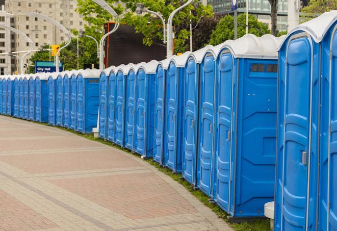 a row of portable restrooms at a fairground, offering visitors a clean and hassle-free experience in pooler